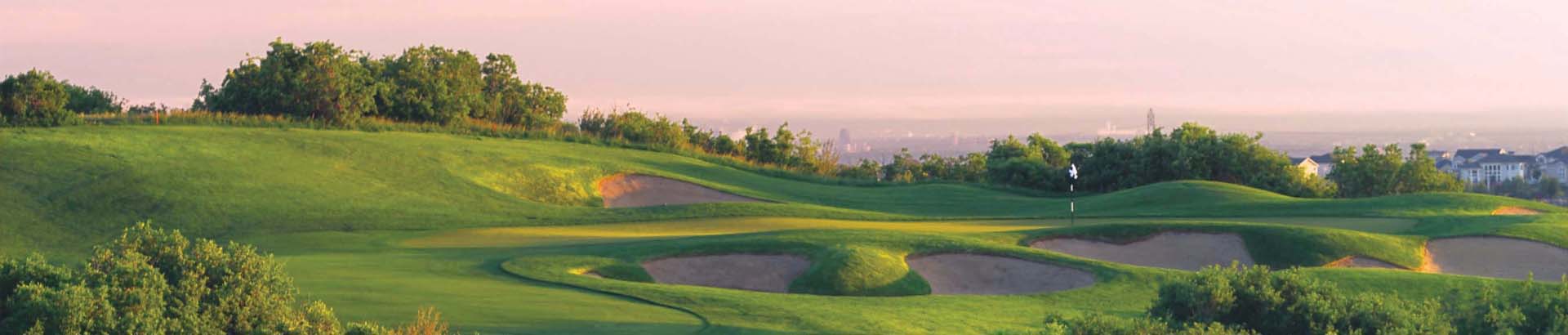 Image of golf ball on tee on grass.